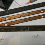 Replacing light bulbs behind P7 circuit breaker light plates.