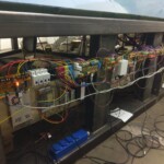 A side view of power supplies, power distribution and SimStack boards on a 747-400 simulator.
